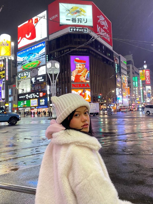 NUMIC student Monin Chanbonnakmey on exchange in Japan, on a Sapporo street at night