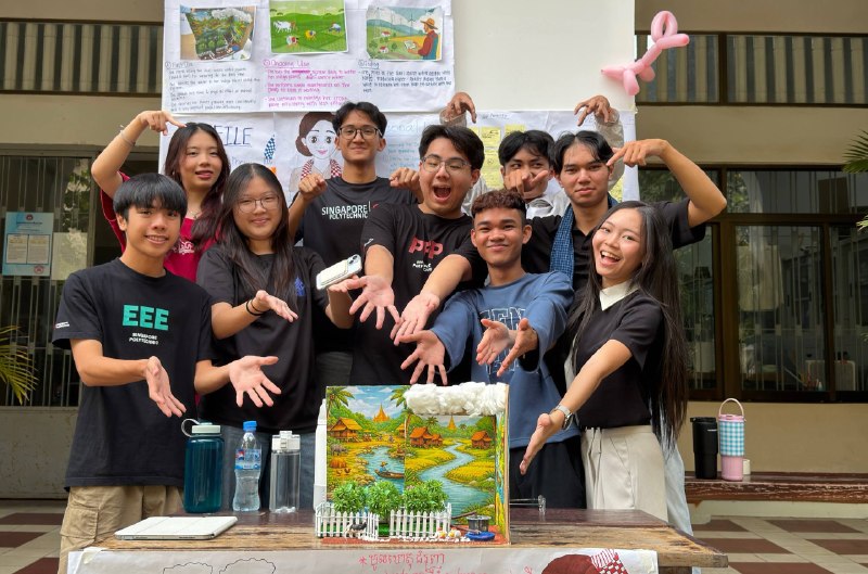 A NUM and Singapore Polytechnic team with their prototype at the gallery walk
